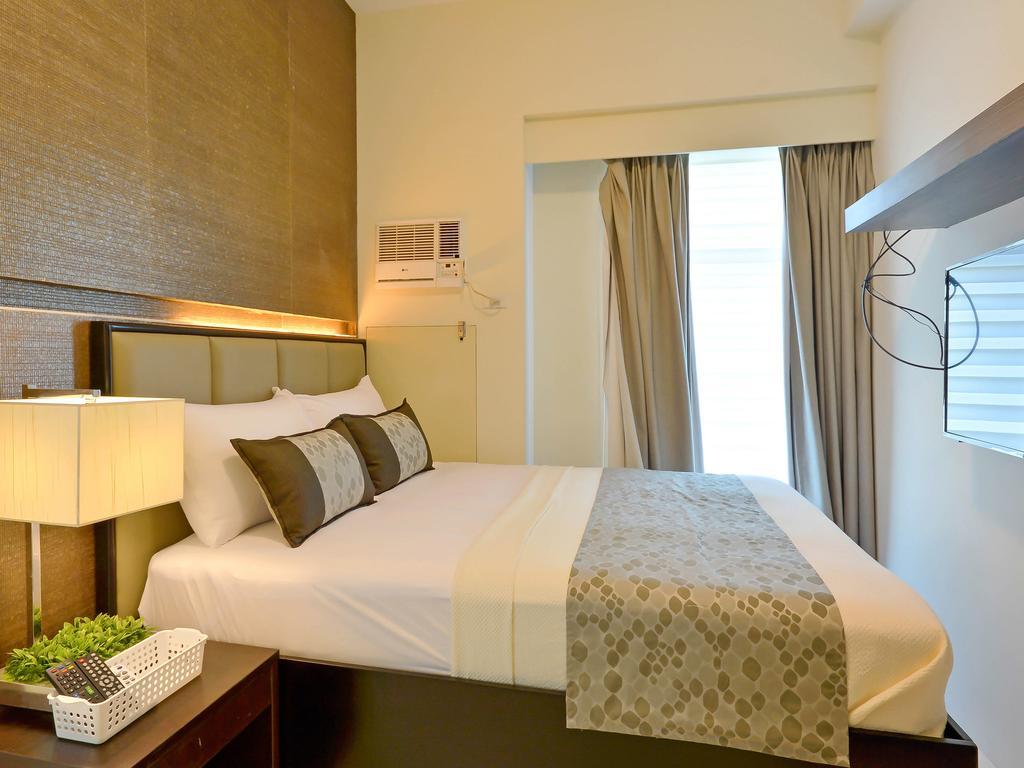 Currency Serviced Suites Manila Exteriör bild