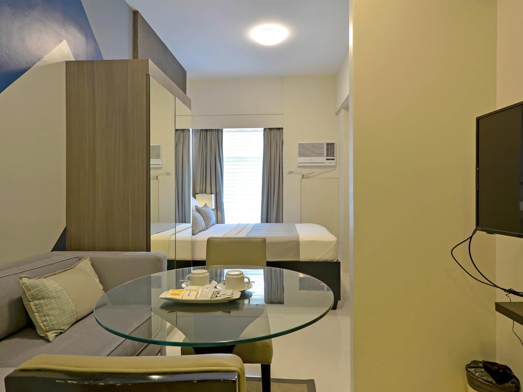 Currency Serviced Suites Manila Exteriör bild