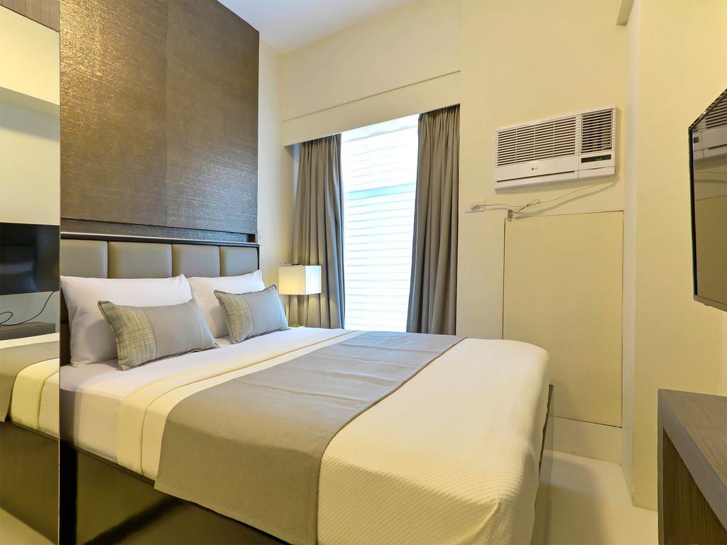 Currency Serviced Suites Manila Exteriör bild